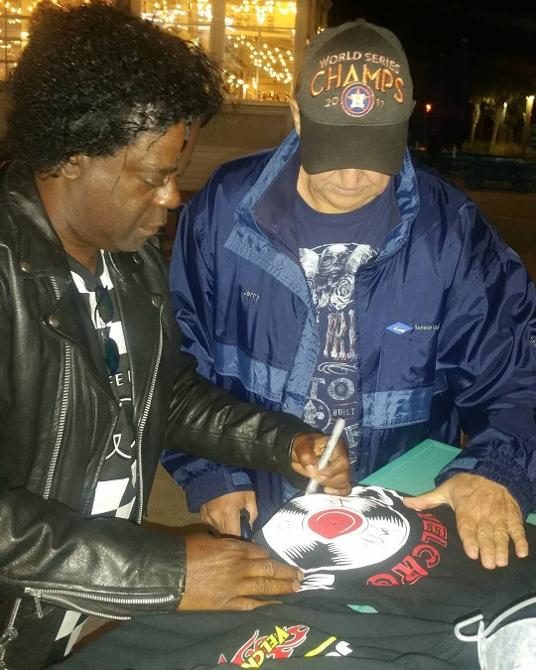 Robert signing a drumhead for a fan